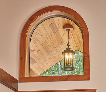 Forgent Series direct set and radius windows with a wood interior.