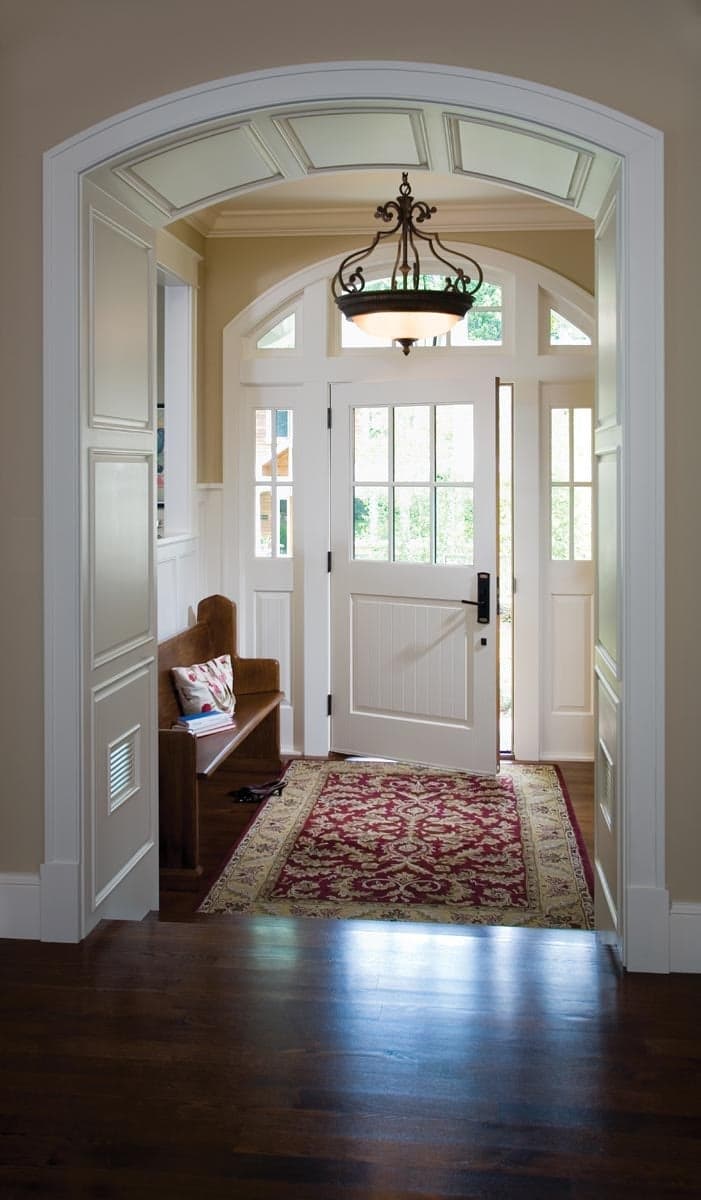 Heritage Series Craftsman inswing entrance door with radius transom and sidelites
Field-finished interior
Performance divided lites, custom raised panel door, Oil-Rubbed hardware