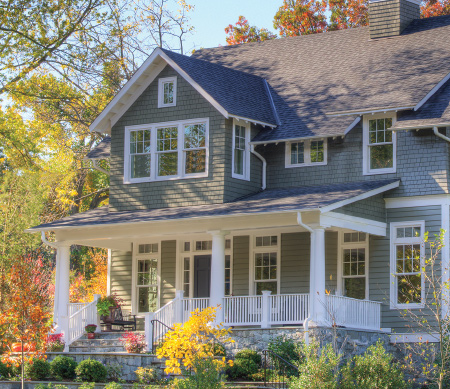 Heritage Series Sterling double hungs and transoms with white exterior finish and PDL bars in the top sash.