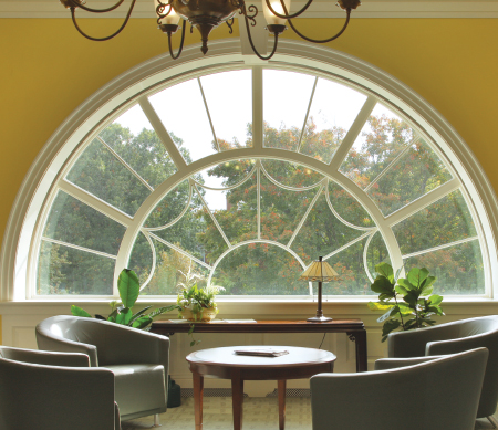 Ultra Series custom ogee direct set windows mulled around a half-circle radius with PDL bars.